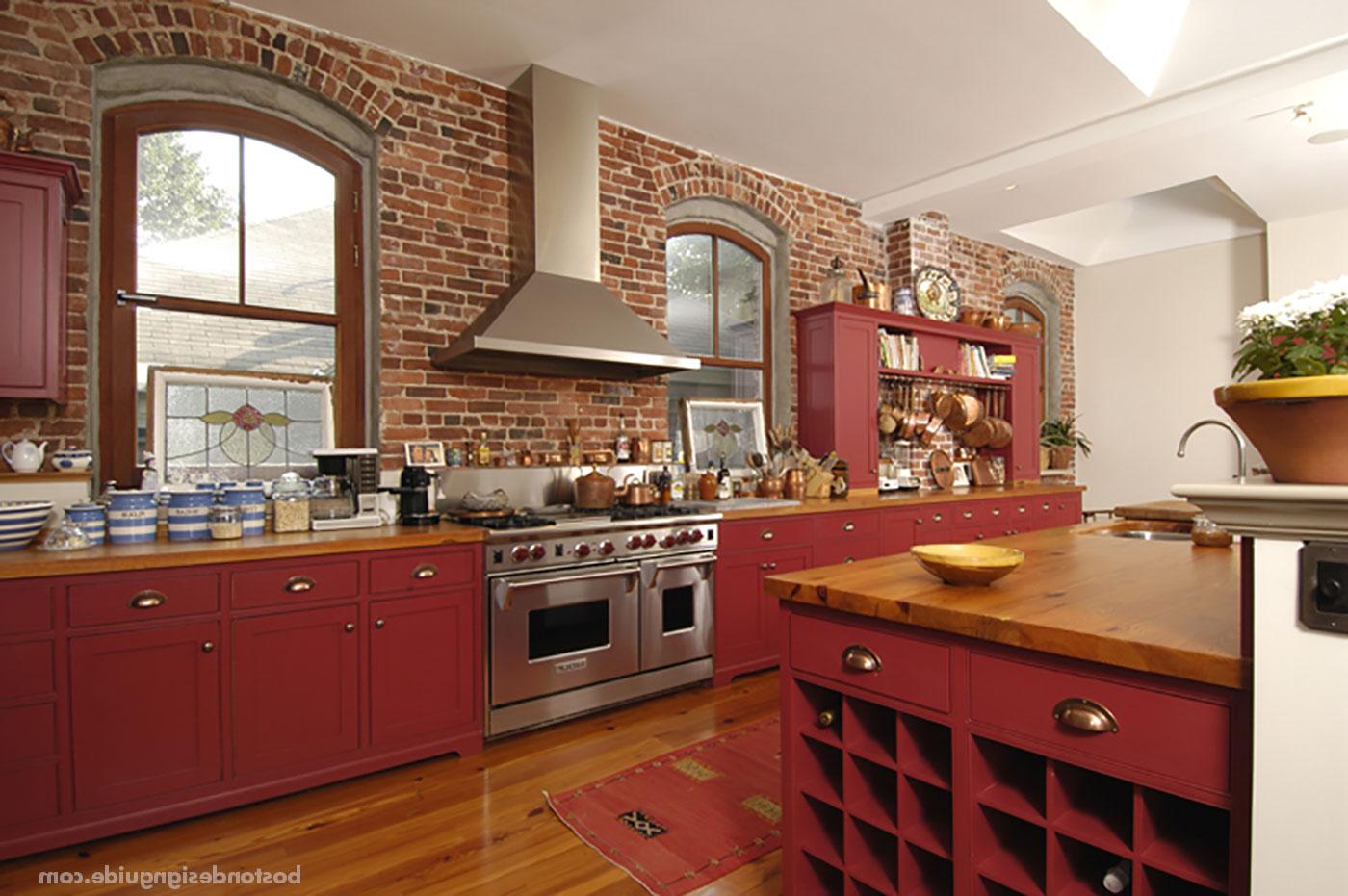 Red kitchen renovation with exposed brick by S + H建设
