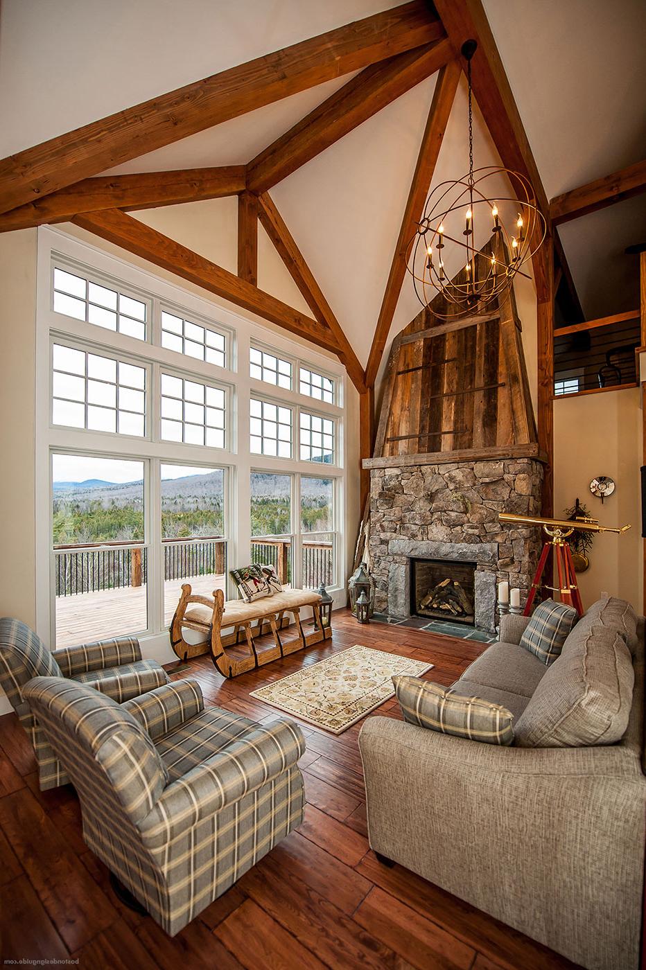 Fireplace in a mountain home by Yankee Barn Homes